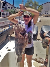 Ashley Ealey holding up a fish