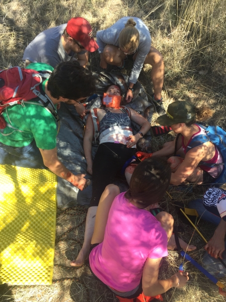 Wilderness medicine students with simulated injured patient