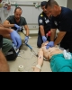 EMS professionals performing CPR on mannequin